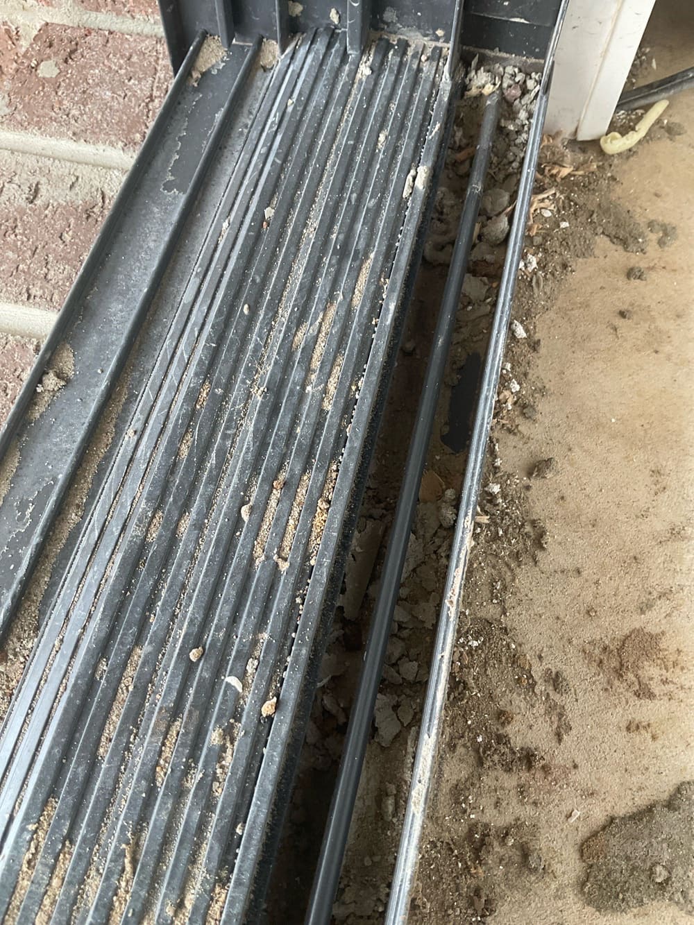 Clean sliding door tracks, recorded during a PCI inspection in Aintree