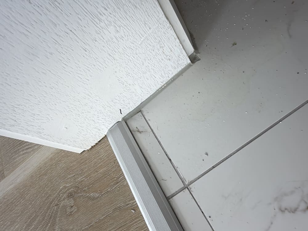 Non compliant door threshold waterproofing detail, recorded during a waterproofing inspection in Clyde North