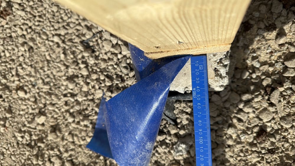 Slab protrudes beyond timber wall by over 20mm trim the slab, recorded during a slab pre-pour inspection in Truganina
